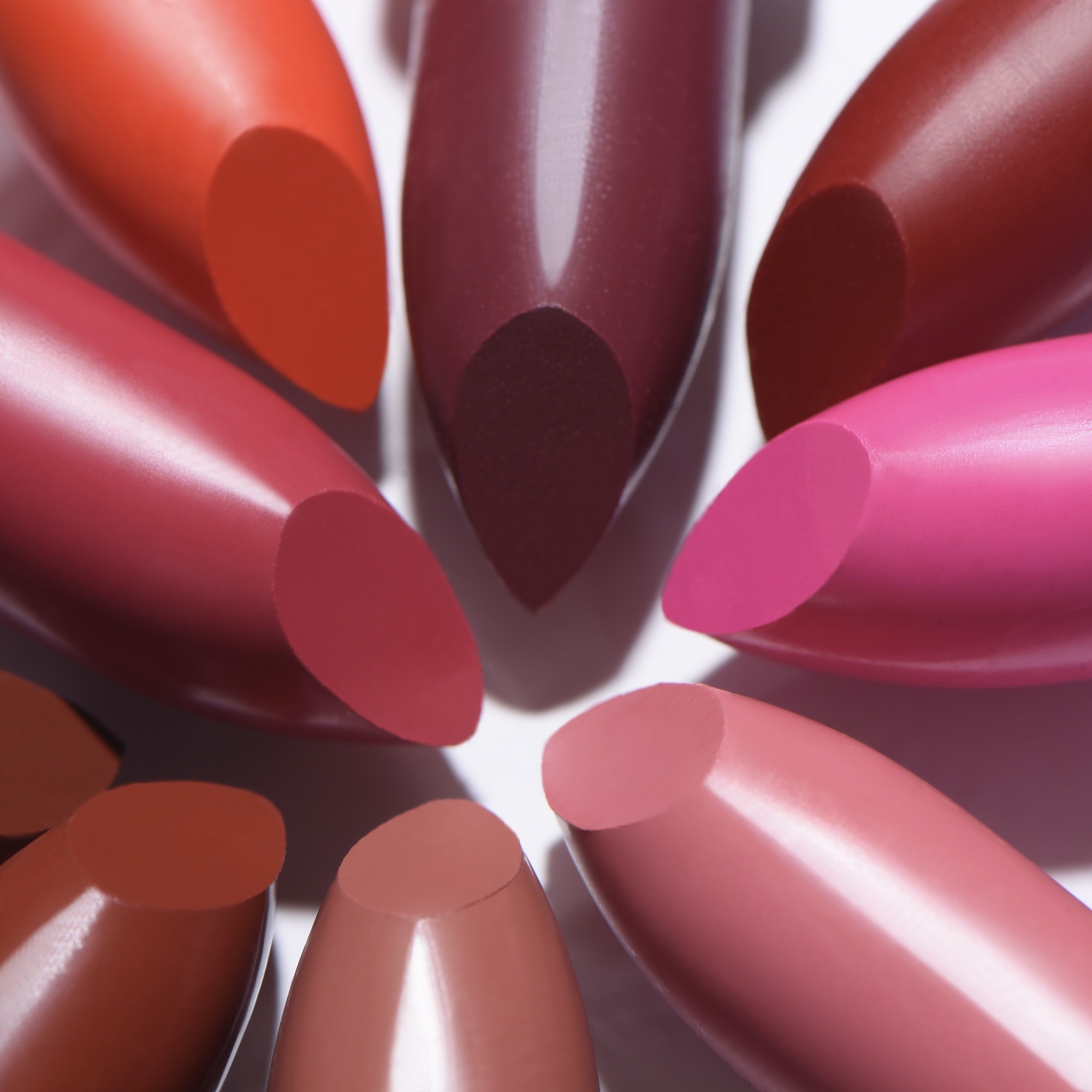 Closeup shot of colorful lipsticks on white